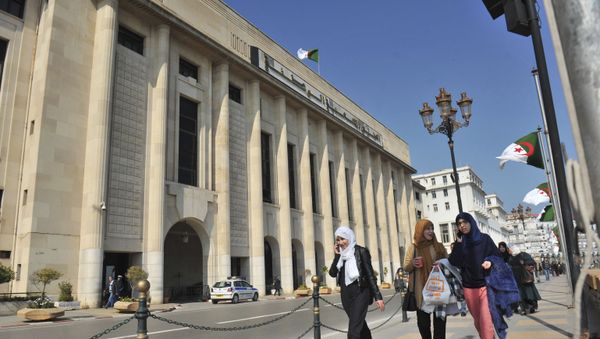 In this photo taken on Thursday, March 2, 2017, Algerian women pass by the People's National Assembly building in Algiers, Algeria - Sputnik International