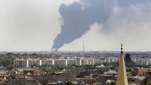 Black smoke billows over the skyline as a fire at the oil depot for the airport rages out of control after being struck in the crossfire of warring militias battling for control of the airfield, in Tripoli, - Sputnik International