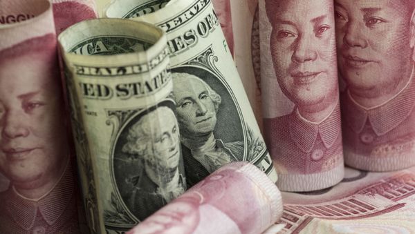 This photo illustration taken on January 6, 2017 shows Chinese 100 yuan notes and one US dollar notes in Beijing This photo illustration taken on January 6, 2017 shows Chinese 100 yuan notes and one US dollar notes in Beijing - Sputnik International