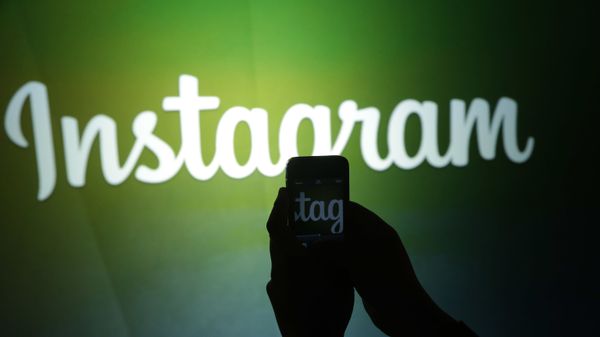 A journalist makes a video of the Instagram logo using the new video feature at Facebook headquarters in Menlo Park, California A journalist makes a video of the Instagram logo using the new video feature at Facebook headquarters in Menlo Park, California - Sputnik International