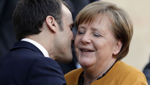 French President Emmanuel Macron kisses German Chancellor Angela Merkel as she leaves the Elysee presidential palace after their meeting in Paris, Wednesday, Feb. 27, 2019.  - Sputnik International