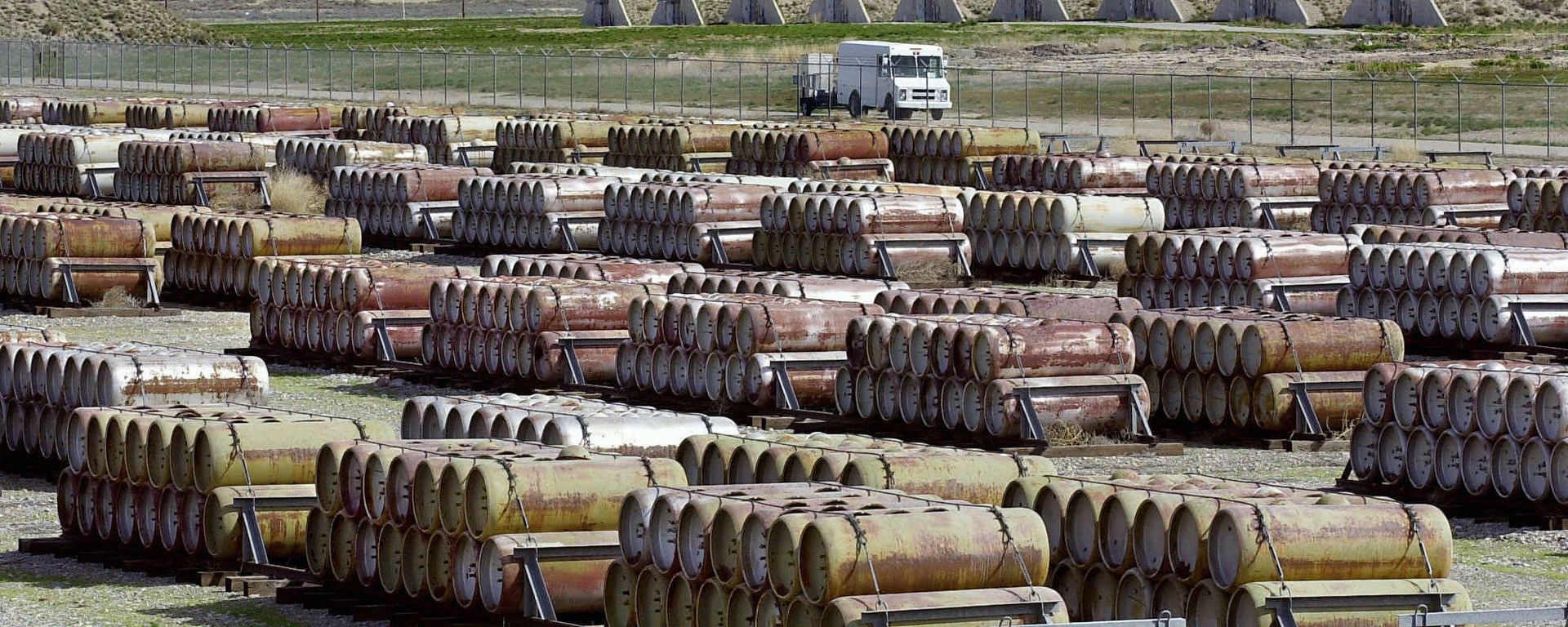This April 30, 2001 file photo shows a safety vehicle passing a compound filled with 170-gallon containers of mustard and blister agent at the Deseret Chemical Depot in Tooele, Utah - Sputnik International, 1920, 19.02.2024
