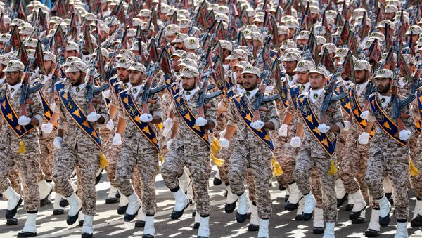 Members of Iran's Revolutionary Guards Corps (IRGC) march during the annual military parade marking the anniversary of the outbreak of the devastating 1980-1988 war with Saddam Hussein's Iraq, in the capital Tehran on September 22, 2018 - Sputnik International