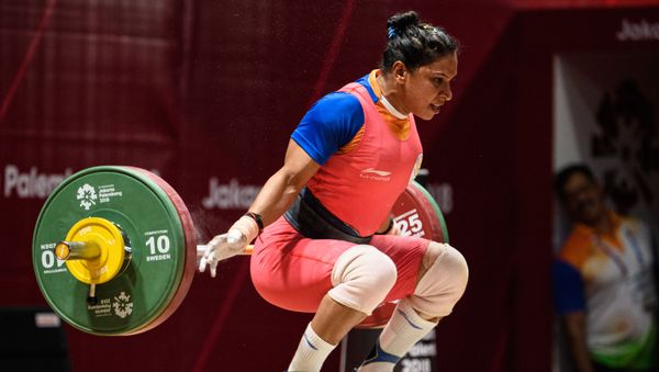 India's Rakhi Halder takes part in the women's 63kg Group A weightlifting event at the 2018 Asian Games in Jakarta on August 24, 2018. (Photo by ANTHONY WALLACE / AFP) - Sputnik International