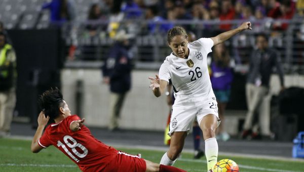 FILE - In this Dec. 13, 2015, file photo, China's Han Peng (18) slides in to knock the ball away from United States' Jaelene Hinkle during the second half of an international friendly soccer match, in Glendale, Ariz - Sputnik International