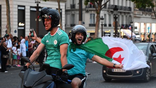Algerian supporters celebrate in Paris after the victory of their team during the 2019 Africa Cup of Nations (CAN) quarter final football match between Ivory Coast and Algeria, on July 11, 2019 - Sputnik International