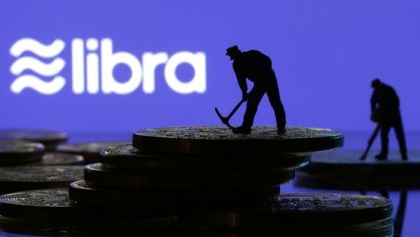 Small toy figures are seen on representations of virtual currency in front of the Libra logo in this illustration picture, June 21, 2019 Small toy figures are seen on representations of virtual currency in front of the Libra logo in this illustration picture, June 21, 2019 - Sputnik International