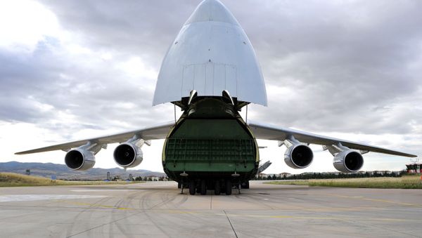 First parts of a Russian S-400 missile defense system are unloaded from a Russian plane at Murted Airport, known as Akinci Air Base, near Ankara, Turkey, July 12, 2019 - Sputnik International
