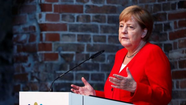 German Chancellor Angela Merkel speaks during a ceremony to mark 50 years of German development aid in Berlin, Germany, July 12, 2019 German Chancellor Angela Merkel speaks during a ceremony to mark 50 years of German development aid in Berlin, Germany, July 12, 2019 - Sputnik International