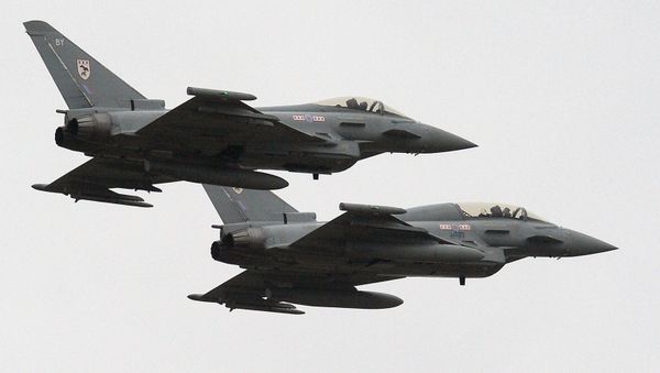 Two British Royal Air Force Typhoon FGR4 aircraft fly over RAF Waddington near Lincoln, England (File) - Sputnik International