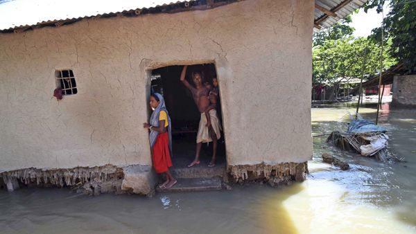Villagers stand inside their house destroyed by floodwaters at Katihar district, in the eastern Indian state of Bihar (File) - Sputnik International