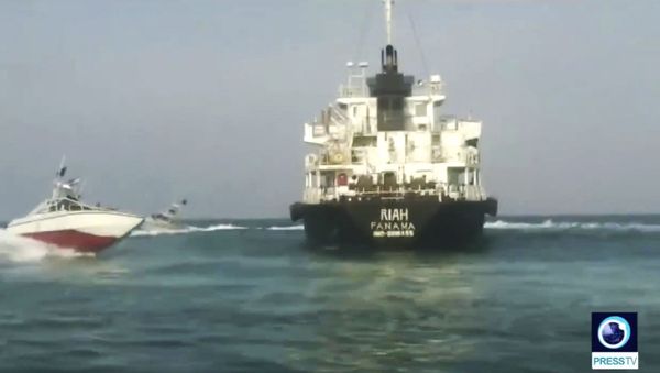 This undated photo provided by Iranian state television's English-language service, Press TV, shows the Panamanian-flagged oil tanker MT Riah surrounded by Iranian Revolutionary Guard vessels.  - Sputnik International