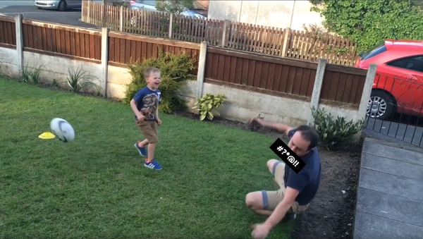 Man cussing after being hit in the mouth by his child's soccer ball - Sputnik International