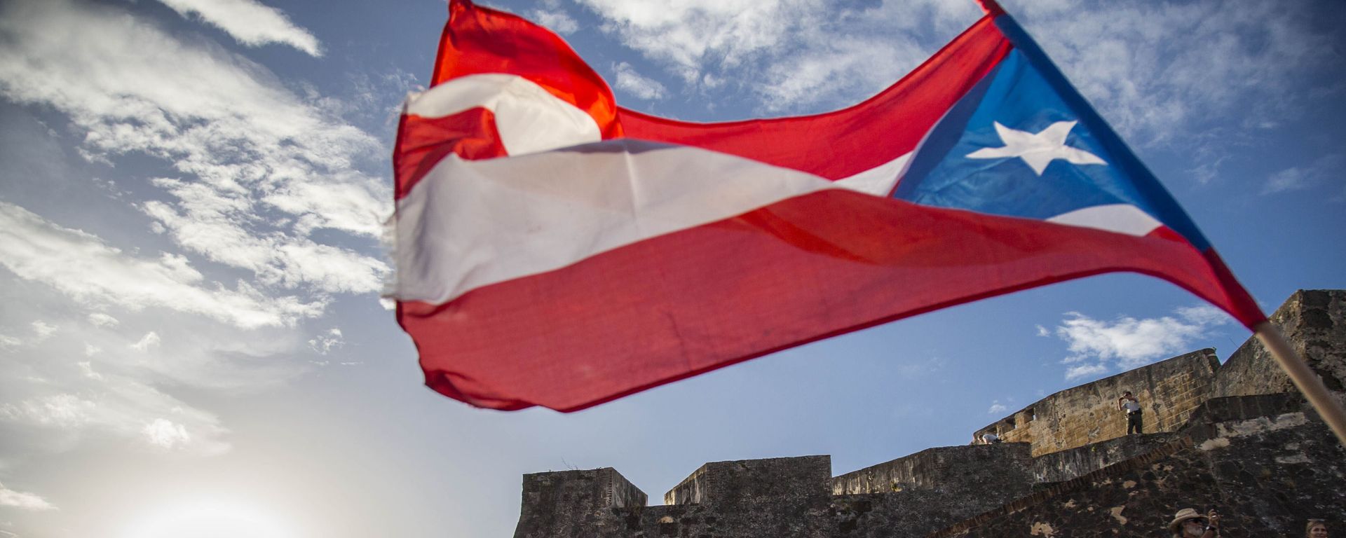Demonstrators march against governor Ricardo Rosello, in San Juan, Puerto Rico, Wednesday, July 17, 2019. Protesters are demanding Rossello step down for his involvement in a private chat in which he used profanities to describe an ex-New York City councilwoman and a federal control board overseeing the island's finance. - Sputnik International, 1920, 26.08.2022