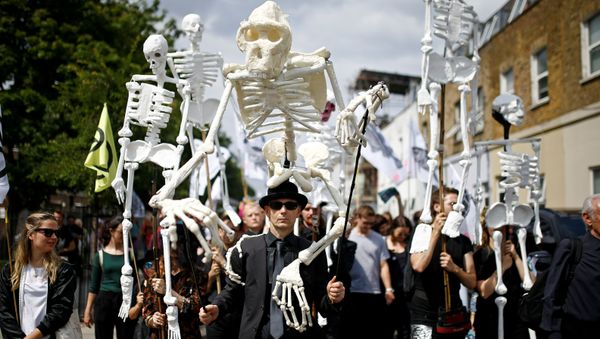 Extinction Rebellion activists march through East London, Britain July 13, 2019 - Sputnik International