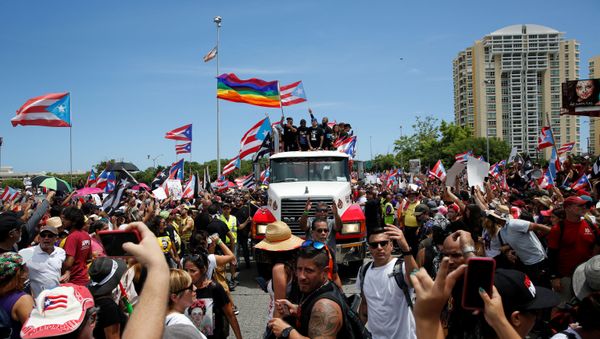 Puerto Rican celebrities including Residente, Bad Bunny and Ricky Martin join demonstrators during a protest calling for the resignation of Governor Ricardo Rossello in San Juan, Puerto Rico July 22, 2019. - Sputnik International
