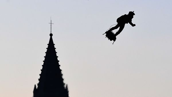 Zapata CEO Franky Zapata flies a jet-powered hoverboard or Flyboard over the old harbour as part of  Bastille Day celebrations in Marseille on July 14, 2019. - Sputnik International