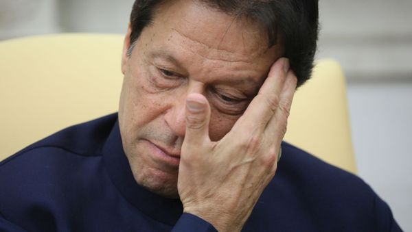Pakistan’s Prime Minister Imran Khan listens while meeting with U.S. President Donald Trump in the Oval Office at the White House in Washington, U.S., July 22, 2019.  - Sputnik International