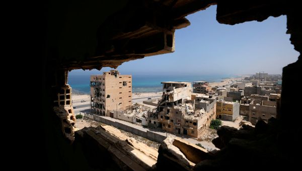 Destroyed buildings are seen through a hole in Benghazi lighthouse after it was severely damaged by years of armed conflict, in Benghazi, Libya July 10, 2019 Destroyed buildings are seen through a hole in Benghazi lighthouse after it was severely damaged by years of armed conflict, in Benghazi, Libya July 10, 2019 - Sputnik International