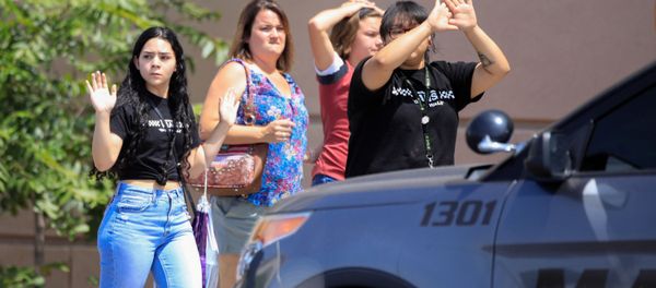 Shoppers exit with their hands up after a mass shooting at a Walmart in El Paso, Texas, U.S. August 3, 2019. REUTERS/Jorge Salgado - Sputnik International