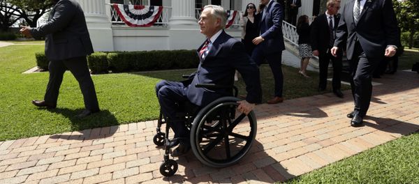 Governor Greg Abbott is followed by Lt. Governor Dan Patrick after a joint press conference to announce changes to teacher pay and school finance at the Texas Governor's Mansion in Austin, Texas, Thursday, May 23, 2019, in Austin. (AP Photo/Eric Gay) - Sputnik International