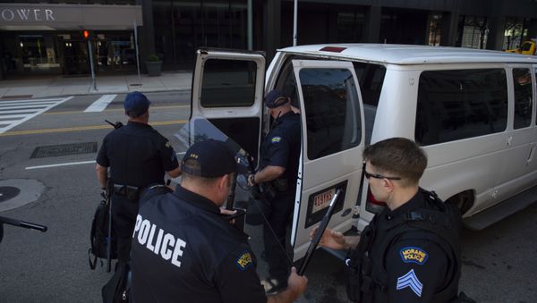 DAYTON, OH - MAY 25: Police officers and Highway State Patrol officers prepare to respond to a rally held by the KKK affiliated group Honorable Sacred Knights of Indiana at Courthouse Square on May 25, 2019 in Dayton, Ohio. DAYTON, OH - MAY 25: Police officers and Highway State Patrol officers prepare to respond to a rally held by the KKK affiliated group Honorable Sacred Knights of Indiana at Courthouse Square on May 25, 2019 in Dayton, Ohio. - Sputnik International