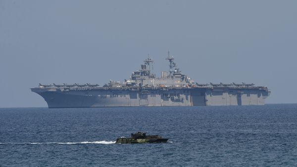 US Marine Amphibious Assault Vehicle (front) maneouvers during the amphibious landing exercises as part of the annual joint US-Philippines military exercise on the shores of San Antonio town, facing the South China sea US Marine Amphibious Assault Vehicle (front) maneouvers during the amphibious landing exercises as part of the annual joint US-Philippines military exercise on the shores of San Antonio town, facing the South China sea - Sputnik International