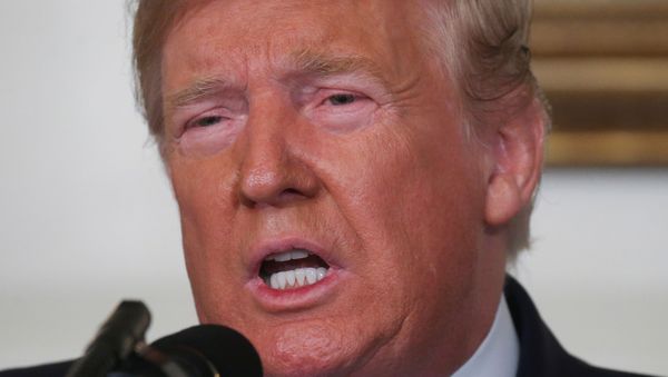 U.S. President Donald Trump speaks about the shootings in El Paso and Dayton in the Diplomatic Room of the White House in Washington, U.S., August 5, 2019. REUTERS/Leah Millis - Sputnik International