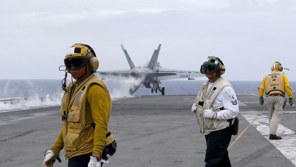 A U.S. fighter jet takes off from the U.S. aircraft carrier USS Ronald Reagan for their patrol at the international waters off South China Sea Tuesday, Aug. 6, 2019 - Sputnik International