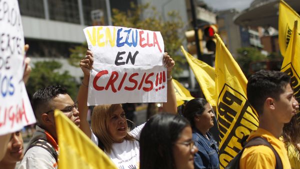 People protest against the Sao Paulo Forum in Caracas, Venezuela, Friday, July 26, 2019. Venezuela is hosting leftist activists from around Latin America at the forum that has been criticized by opponents who say the fragile country can hardly afford to entertain hundreds of international guests. - Sputnik International