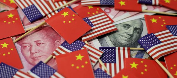 A U.S. dollar banknote featuring American founding father Benjamin Franklin and a China's yuan banknote featuring late Chinese chairman Mao Zedong are seen among U.S. and Chinese flags in this illustration picture taken May 20, 2019 A U.S. dollar banknote featuring American founding father Benjamin Franklin and a China's yuan banknote featuring late Chinese chairman Mao Zedong are seen among U.S. and Chinese flags in this illustration picture taken May 20, 2019 - Sputnik International