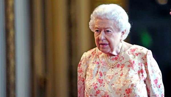 Britain's Queen Elizabeth II views an exhibition to mark the 200th anniversary of the birth of Queen Victoria, for the Summer Opening of Buckingham Palace in London on July 17, 2019 - Sputnik International