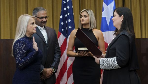 Justice Secretary Wanda Vazquez is sworn in as governor of Puerto Rico by Supreme Court Justice Maite Oronoz, in San Juan, Puerto Rico, Wednesday, Aug. 7, 2019. Vazquez took the oath of office early Wednesday evening at the Puerto Rican Supreme Court, which earlier in the day ruled that Pedro Pierluisi's swearing in last week was unconstitutional. Vazquez was joined by her daughter Beatriz Diaz Vazquez and her husband Judge Jorge Diaz. - Sputnik International