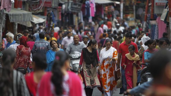 Muslim women return after getting fresh henna decorations on their hands on the eve of Eid al Adha, in Jammu, India, Sunday, Aug.11, 2019.  - Sputnik International