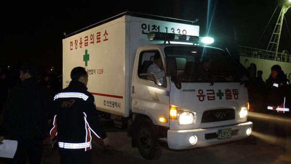 South Korean firefighters and ambulance get on a boat heading to Yeonpyeong Island, at a port in Incheon, west of Seoul, South Korea - Sputnik International