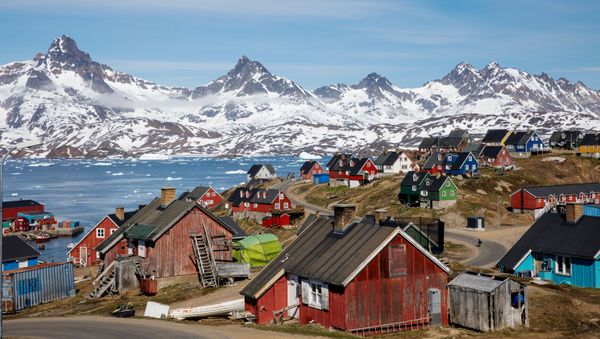 Snow covered mountains rise above the harbour and town of Tasiilaq, Greenland, June 15, 2018 - Sputnik International