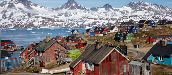 Snow covered mountains rise above the harbour and town of Tasiilaq, Greenland, June 15, 2018 - Sputnik International