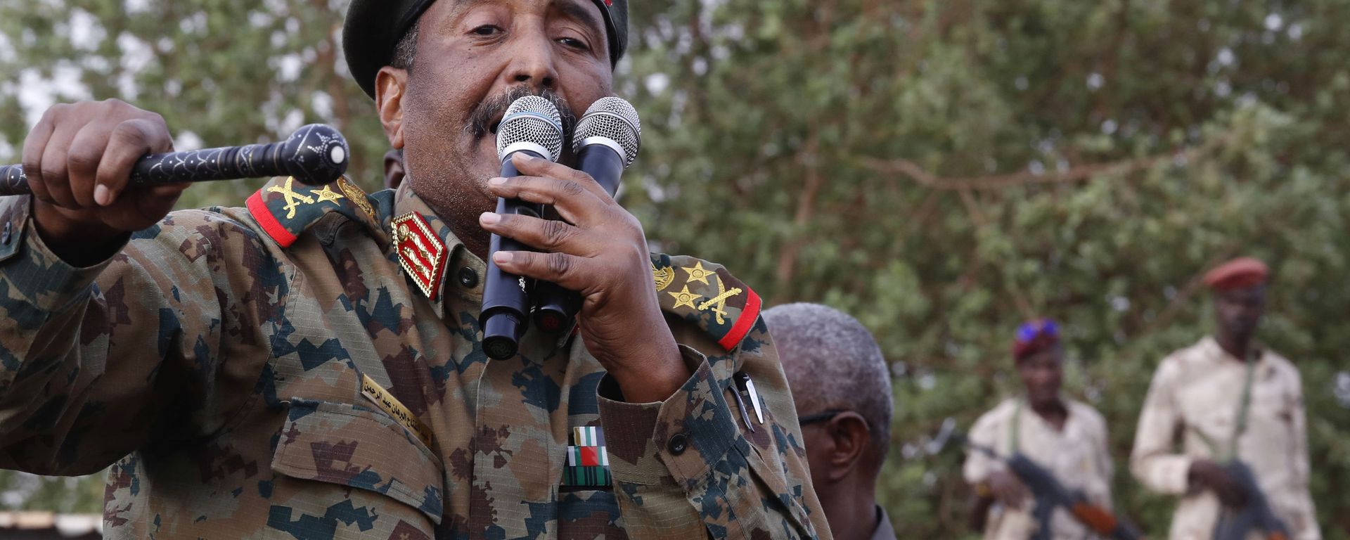 In this June 29, 2019, file photo, Sudanese Gen. Abdel-Fattah Burhan, head of the military council, speaks during a military-backed rally, in Omdurman district, west of Khartoum, Sudan. An African Union envoy says Sudan's ruling military council and the country's pro-democracy movement have reached a power-sharing agreement, including a timetable for a transition to civilian rule. Mohammed el-Hassan Labat said early Friday, July 5, that both sides agreed to form a joint sovereign council that will rule the country for three years or a little more. The sides agreed to five seats for the military and five for civilians with an additional seat going to a civilian with military background. In this June 29, 2019, file photo, Sudanese Gen. Abdel-Fattah Burhan, head of the military council, speaks during a military-backed rally, in Omdurman district, west of Khartoum, Sudan. An African Union envoy says Sudan's ruling military council and the country's pro-democracy movement have reached a power-sharing agreement, including a timetable for a transition to civilian rule. Mohammed el-Hassan Labat said early Friday, July 5, that both sides agreed to form a joint sovereign council that will rule the country for three years or a little more. The sides agreed to five seats for the military and five for civilians with an additional seat going to a civilian with military background. - Sputnik International, 1920, 25.10.2021