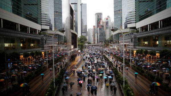 Anti-extradition bill protesters take part in the march to demand democracy and political reforms in Hong Kong - Sputnik International