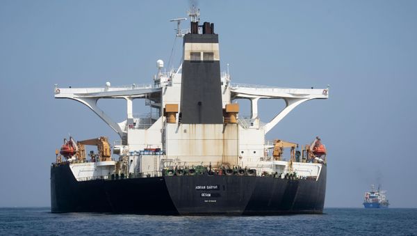 A view of the Grace 1 super tanker with the name Adrian Darya 1 over the place where Grace 1 had already been blackened out is seen in the British territory of Gibraltar, Saturday, Aug. 17, 2019. The shipping agent for an Iranian supertanker caught in a diplomatic standoff says the vessel is ready to depart Gibraltar in 24 to 48 hours, despite a last-minute effort by the United States to seize it again. (AP Photo/Marcos Moreno) - Sputnik International