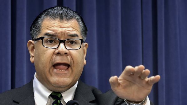 FILE - In this March 25, 2014 file photo, Illinois Sen. Martin Sandoval, D-Cicero, speaks during a news conference at the Illinois state Capitol, in Springfield, Ill. The Illinois Senate is urging Gov. Bruce Rauner to reject a presidential call to send National Guard troops to help secure the U.S.-Mexican borde - Sputnik International