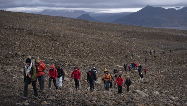 People climb to the top of what once was the Okjokull glacier, in Iceland, Sunday, Aug. 18, 2019.  - Sputnik International