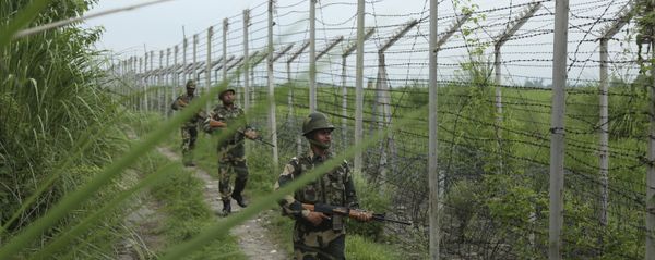 India's Border Security Force (BSF) soldiers patrol near the India Pakistan border fencing at Garkhal in Akhnoor, about 35 kilometers (22 miles) west of Jammu, India, Tuesday, Aug.13, 2019 India's Border Security Force (BSF) soldiers patrol near the India Pakistan border fencing at Garkhal in Akhnoor, about 35 kilometers (22 miles) west of Jammu, India, Tuesday, Aug.13, 2019 - Sputnik International