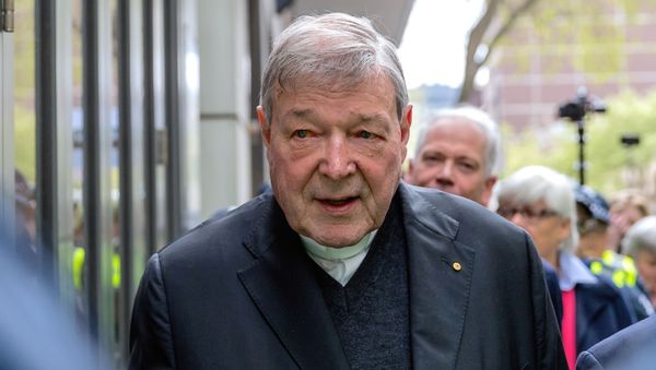 Vatican Treasurer Cardinal George Pell is surrounded by Australian police as he leaves the Melbourne Magistrates Court in Australia - Sputnik International