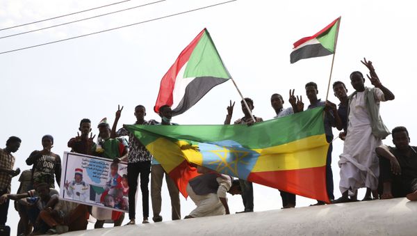 Sudanese protesters celebrate a final power-sharing agreement with the ruling military council Saturday, Aug 17, 2019, in the capital, Khartoum. - Sputnik International