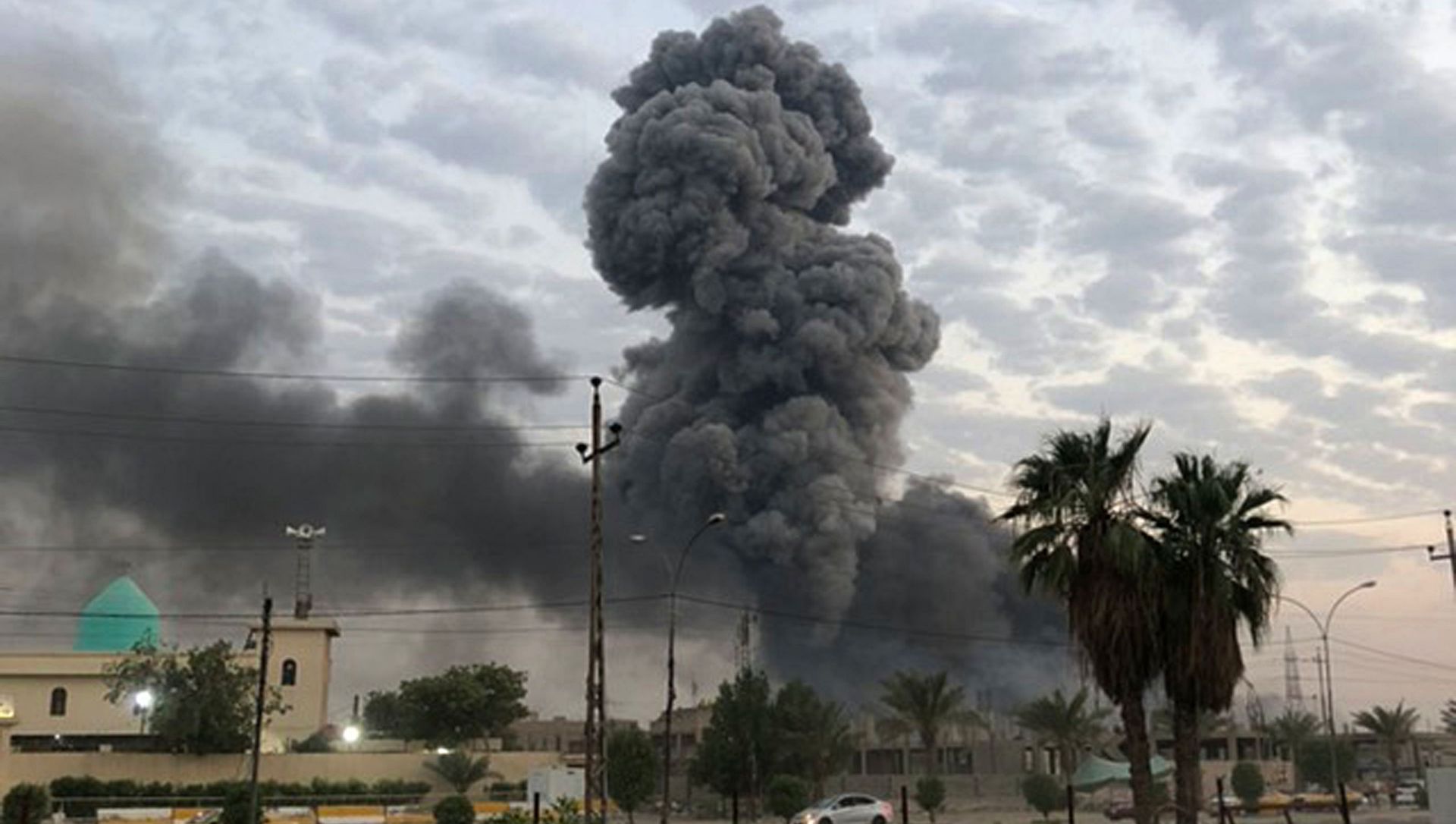 In this Monday, Aug. 12, 2019 file photo, plumes of smoke rise after an explosion at a military base southwest of Baghdad, Iraq. A fact-finding committee appointed by the Iraqi government to investigate a massive munitions depot explosion near the capital Baghdad has concluded that the blast was the result of a drone strike. A copy of the report was obtained by The Associated Press Wednesday, Aug. 21, 2019 In this Monday, Aug. 12, 2019 file photo, plumes of smoke rise after an explosion at a military base southwest of Baghdad, Iraq. A fact-finding committee appointed by the Iraqi government to investigate a massive munitions depot explosion near the capital Baghdad has concluded that the blast was the result of a drone strike. A copy of the report was obtained by The Associated Press Wednesday, Aug. 21, 2019 - Sputnik International, 1920, 23.02.2021
