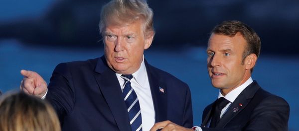 French President Emmanuel Macron talks with U.S. President Donald Trump after posing for a family photo with invited guests during the G7 summit in Biarritz, France, August 25, 2019. French President Emmanuel Macron talks with U.S. President Donald Trump after posing for a family photo with invited guests during the G7 summit in Biarritz, France, August 25, 2019. - Sputnik International