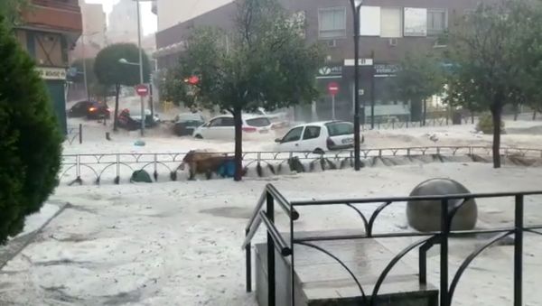 Cars are seen during the heavy rains in Arganda del Rey, Madrid, Spain in this photo grab obtained from a social media video, August 26, 2019 - Sputnik International