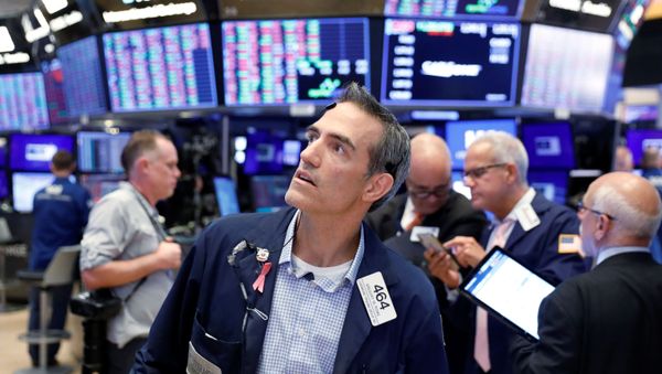 Traders work on the floor of the New York Stock Exchange shortly after the closing bell in New York, U.S., August 23, 2019 - Sputnik International