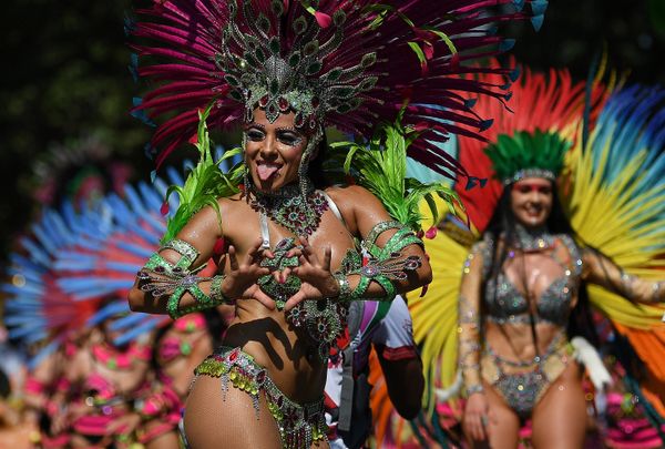 Performers in costumes take part in the carnival on the main Parade day of the Notting Hill Carnival in west London on August 26, 2019.  - Sputnik International